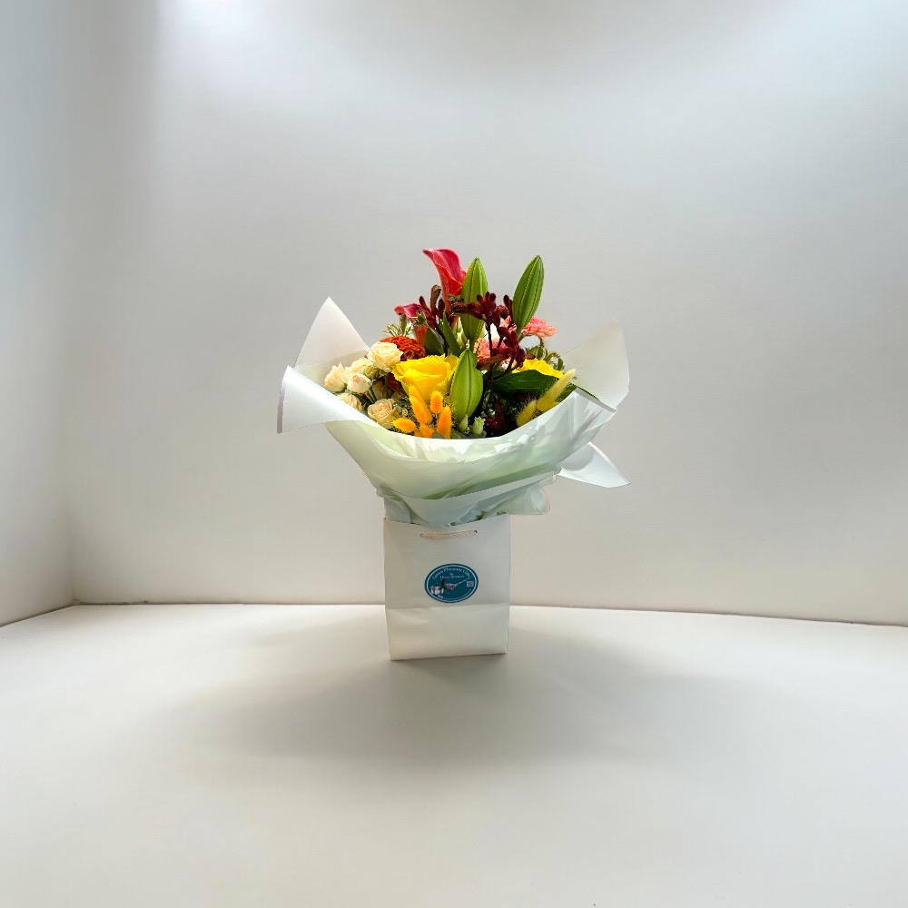 Hand Tied Bouquet in Gift Bag – Yellow/Orange Colours Hand tied bouquet yellow orange .jpeg