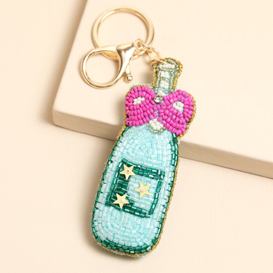 BEADED CHAMPAGNE WITH PINK BOW KEYRING AND BAG CHARM BEADED CHAMPAGNE WITH PINK BOW KEYRING AND BAG CHARM